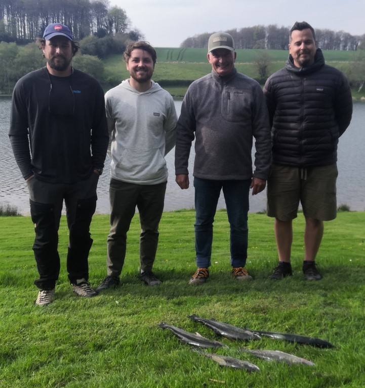 Declan, Jake, Jason and Chris with 5 trout caught on their fly fishing lesson