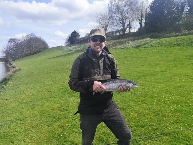 Matt with his first fly fished rainbow.