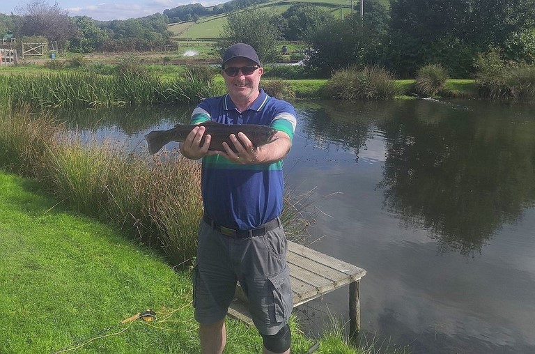 Rob with his Trout Rob with his exe valley trout