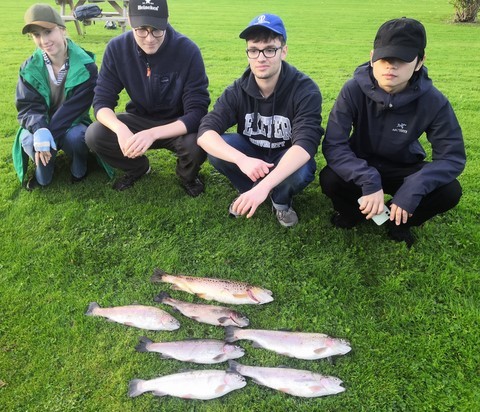 The four of them with their catch Exeter university fishing society